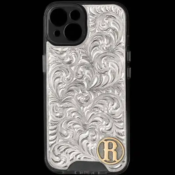 "An elegant addition to elevate your western flair. Our Red Ryder Custom Phone Case features a hand-engraved German Silver plate securely attached to the phone case base. Each scroll is expertly hand-engraved, ensuring  every Red Ryder case one of a 